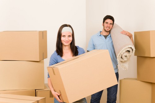 Removal crew carrying items through a property with care