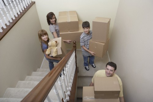 Professional movers loading household items for a Southwark relocation